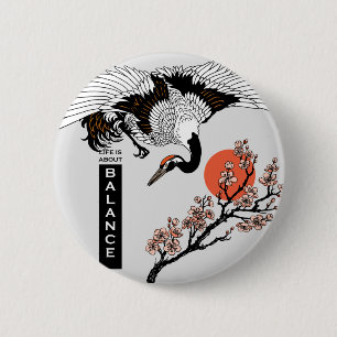 Japanese crane bird and blooming sakura button