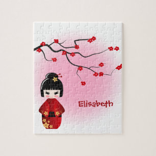 Japanische kokeshi Puppe an Kirschblüte-Blüten Puzzle