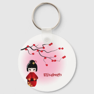 Japanische kokeshi Puppe in Kirschblüte blüht Na Schlüsselanhänger