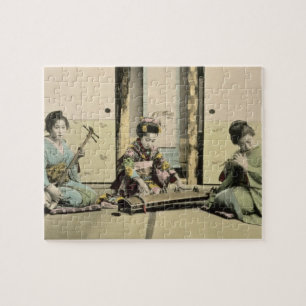 Japanische Mädchen, welche die Flöte, "den Koto" Puzzle