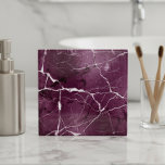 Jewel Tones Marble Abstract Plum Purple ID1288 Fliese<br><div class="desc">This striking ceramic tile features an elegant marble design in deep plum purple accented with crisp white veining and subtle gradient shading. The luxurious dark jewel tones and dappled stone texture bring depth and sophistication to any space. Ideal for backsplash installations, bathrooms, or feature walls. Search ID1288 to see additional...</div>
