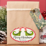 Jolly Christmas Elf Legs Stripes Holiday OVAL Ovaler Aufkleber<br><div class="desc">Die OVAL Aufkleber sind wunderschön für Gastgeschenke,  Geschenke,  Einladungen,  hausgemachte Geschenke und vieles mehr. Sie tragen rote und elfenbeingestreifte Strumpfhosen und grüne Stiefel mit Glocken und Ihre Weihnachtsdetails in schicker Schrift. ***ALLE SHAPES sind bereits für Sie in unserem Shop fertig und sehen die MATCHING-Artikel in der Sammlung.</div>