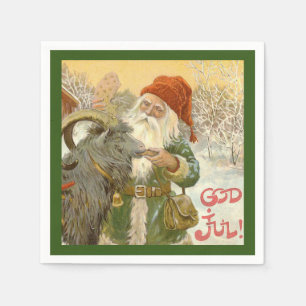 Jultomten füttert Weihnachten-Ziege ein Plätzche Serviette