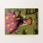 Junge mit Strohhut spielt mit Entlein Puzzle (Horizontal)