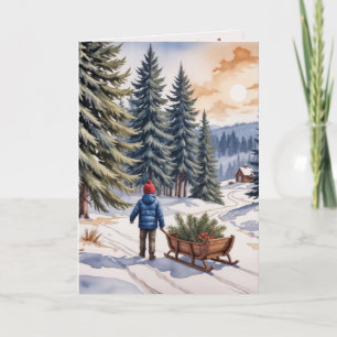 Junge zieht einen Schlitten mit Weihnachts-Tannen- Karte