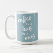 Kaffee ist ein Umarmer in einer Tasse Mute Blue Ta (Links)