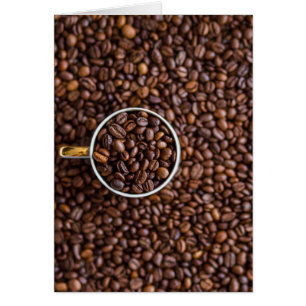 Kaffeebohnen mit Kaffee-Cup voller Bohnen