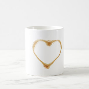 Kaffeefleck in Form eines braunen Herzens Kaffeetasse