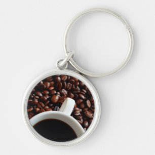 Kaffeetasse mit Kaffee, Kaffeebohnen Hintergrund Schlüsselanhänger