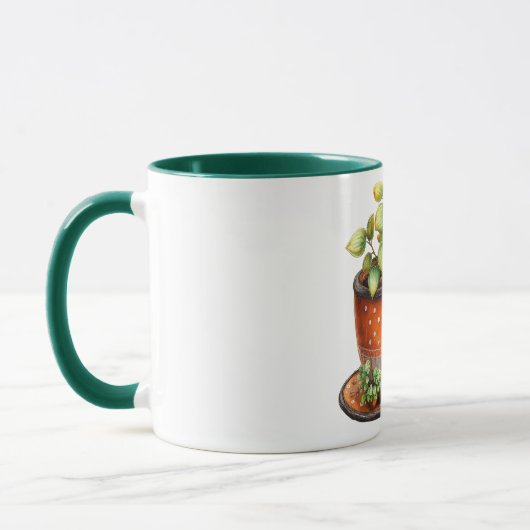 Kaffeetasse mit Kaffeetasse mit Pflanze darin (Links)