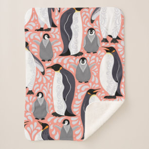 Kaiserpinguine und ihre Naben auf einem rosa Muste Sherpadecke