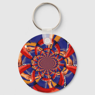Kaleidoskophand, die orange Blau der roten Schlüsselanhänger