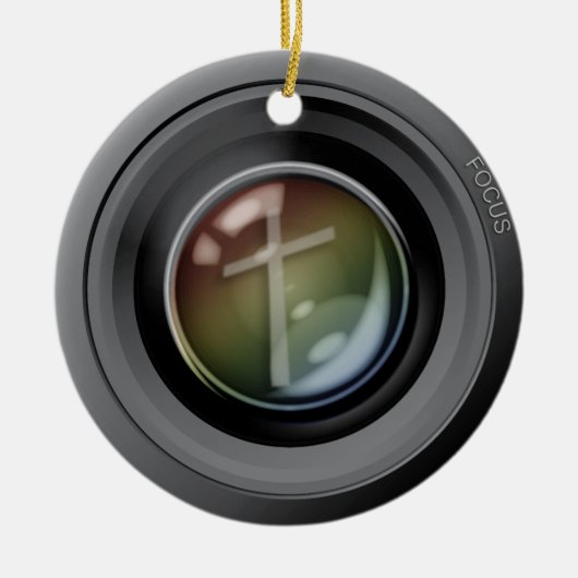 Kameraobjektiv-Verzierung. Fokus auf Jesus Keramik Ornament (Vorne)