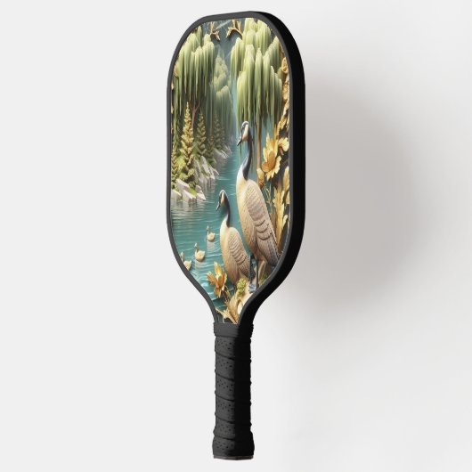 Kanada Gänse inmitten der weinenden Willows Pickleball Schläger (Links)