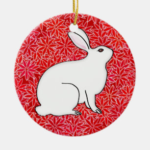 Kaninchen auf einem Bett mit Frühlingsblumen Keramik Ornament