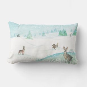 Kaninchen sitzen und im Schnee springen Lendenkissen