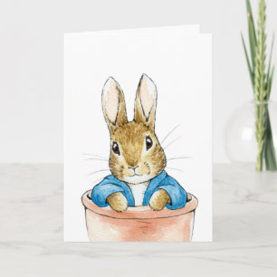 Kaninchen sitzt in einem Blumenkübel Karte