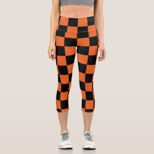 Karierte Quadrate Schwarze und orange geometrische Capri Leggings