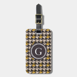 Kariertes Monogramm des Vintagen gelben Gepäckanhänger