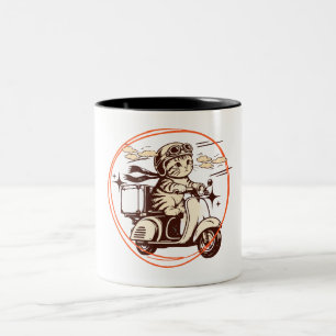 Kätzchen auf einem Roller Zweifarbige Tasse