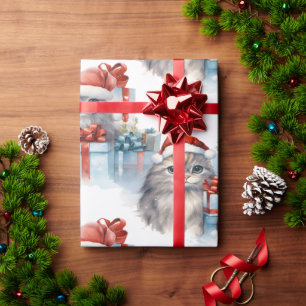 Kätzchen aus der Geschenkverpackung Geschenkpapier