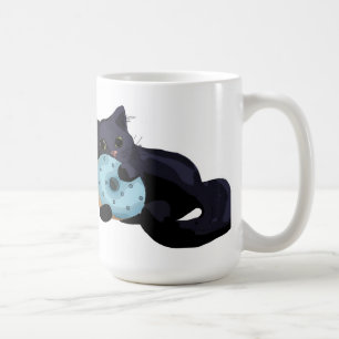 Kätzchen, das Krapfen-Tasse isst Kaffeetasse