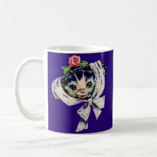 Kätzchenkatze in einem Kätzchen Kaffeetasse