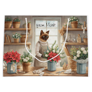 Katze arrangiert Winterblumen für Weihnachten Große Geschenktüte