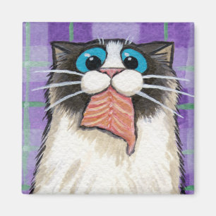 Katze, die Lachsmagneten isst Magnet