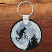Katze fährt Fahrrad auf dem Mondhintergrund. Schlüsselanhänger (Vorderseite)