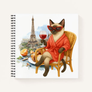 Katze im Ruhestand trinkt Wein in Paris Frankreich Notizblock
