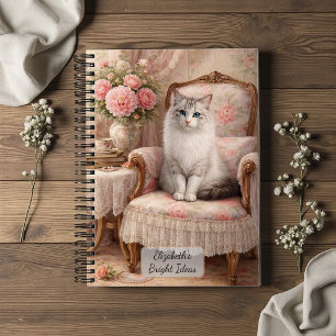 Katze in floralem Sessel Notizblock