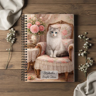Katze in floralem Sessel Notizblock