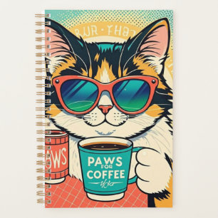 Katze mit überdimensionaler Sonnenbrille und einem Planer