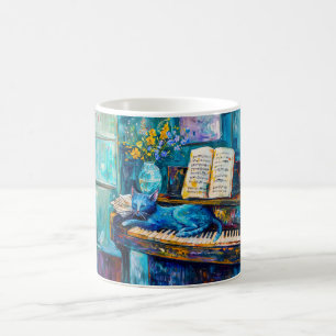 Katze schläft auf dem Klavier Kaffeetasse