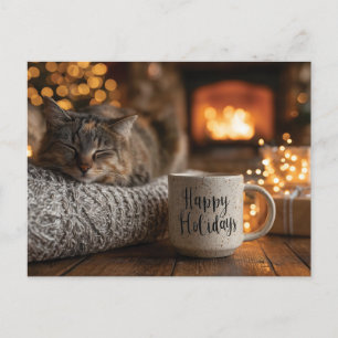 Katze schläft neben einer "Frohe Feiertage"-Tasse Postkarte