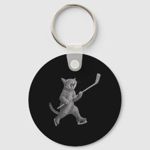 Katze spielt Eishockeyschläger Lustige Eislaufkatz Schlüsselanhänger