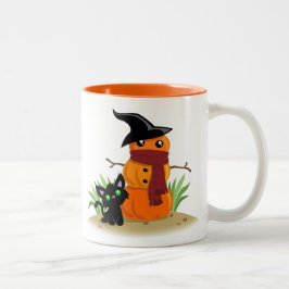 Katze und die Tasse des Pumpkinman-Kaffees