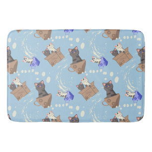 Katzen in Kiste und Milchfallen auf blau Badematte