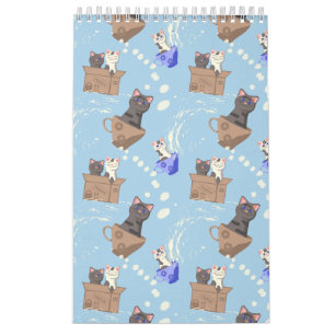 Katzen in Kiste und Milchfallen auf blau Kalender