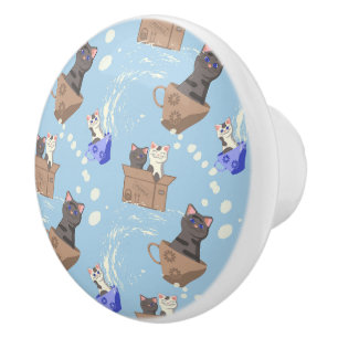 Katzen in Kiste und Milchfallen auf blau Keramikknauf