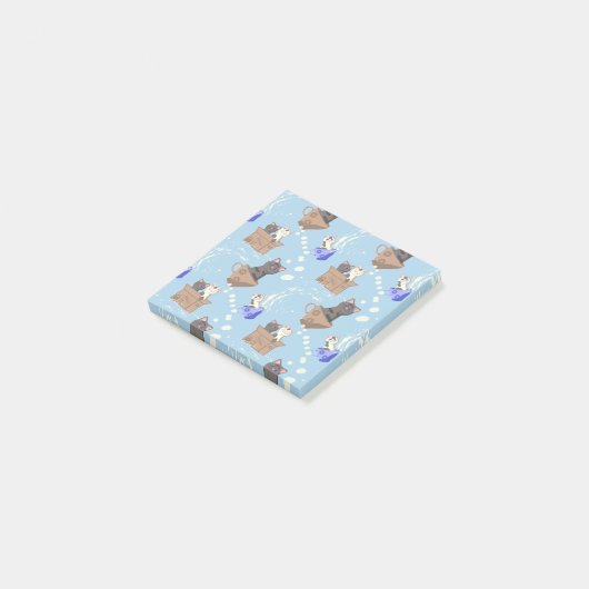 Katzen in Kiste und Milchfallen auf blau Post-it Klebezettel (angewinkelt)