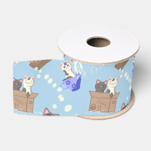 Katzen in Kiste und Milchfallen auf blau Ripsband