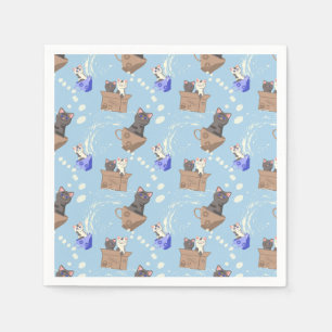 Katzen in Kiste und Milchfallen auf blau Serviette