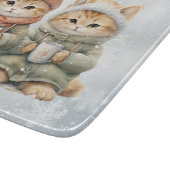 Katzen trinken heiße Schokolade im Schnee Schneidebrett (Ecke)