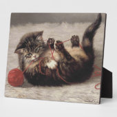 Katzenklatsche, eine Katze, die Galle aus dem Garn Fotoplatte (Seite)