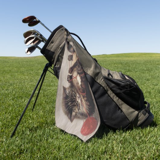 Katzenklatsche, eine Katze, die Galle aus dem Garn Golfhandtuch (Gras)