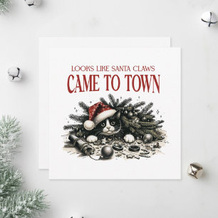 Katzenunterkunft unter einem Weihnachtsbaum. Feiertagskarte