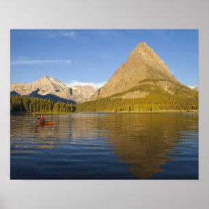 Kayaking in Swiftcurrent Lake at sunrise in the Poster