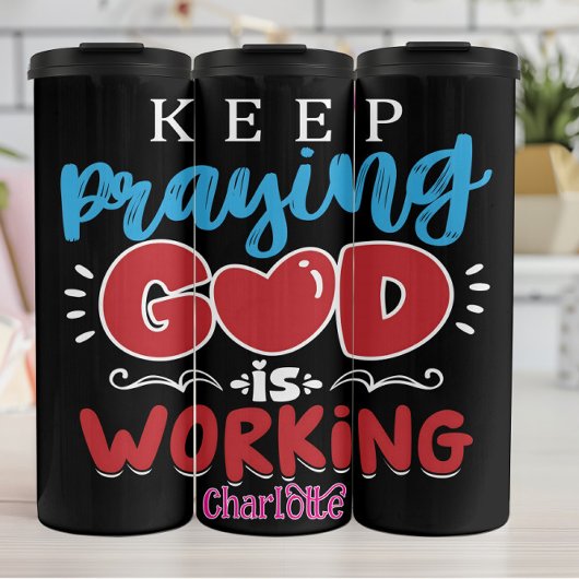 Keep Praying God Is Working Thermosbecher